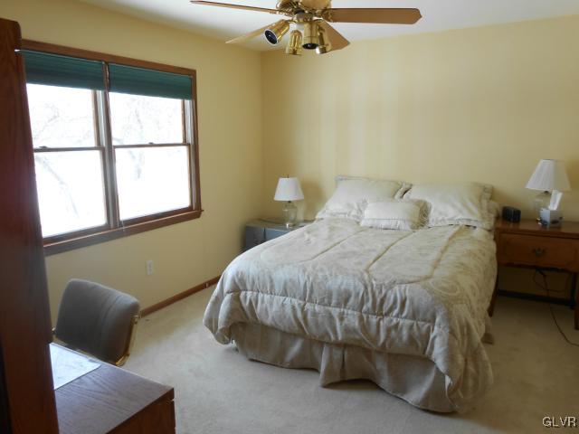 250 Ridgewood Road Easton, PA 18045 - Photo 13 of 21 a bed sitting in a bedroom next to a window
