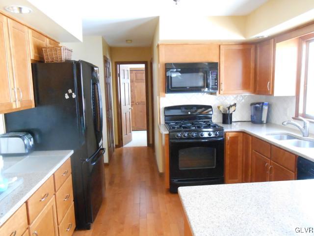 250 Ridgewood Road Easton, PA 18045 - Photo 8 of 21 a kitchen with stainless steel appliances a stove refrigerator sink and cabinets