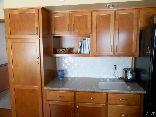 250 Ridgewood Road Easton, PA 18045 - Photo 9 of 21 a kitchen with appliances a refrigerator and cabinets