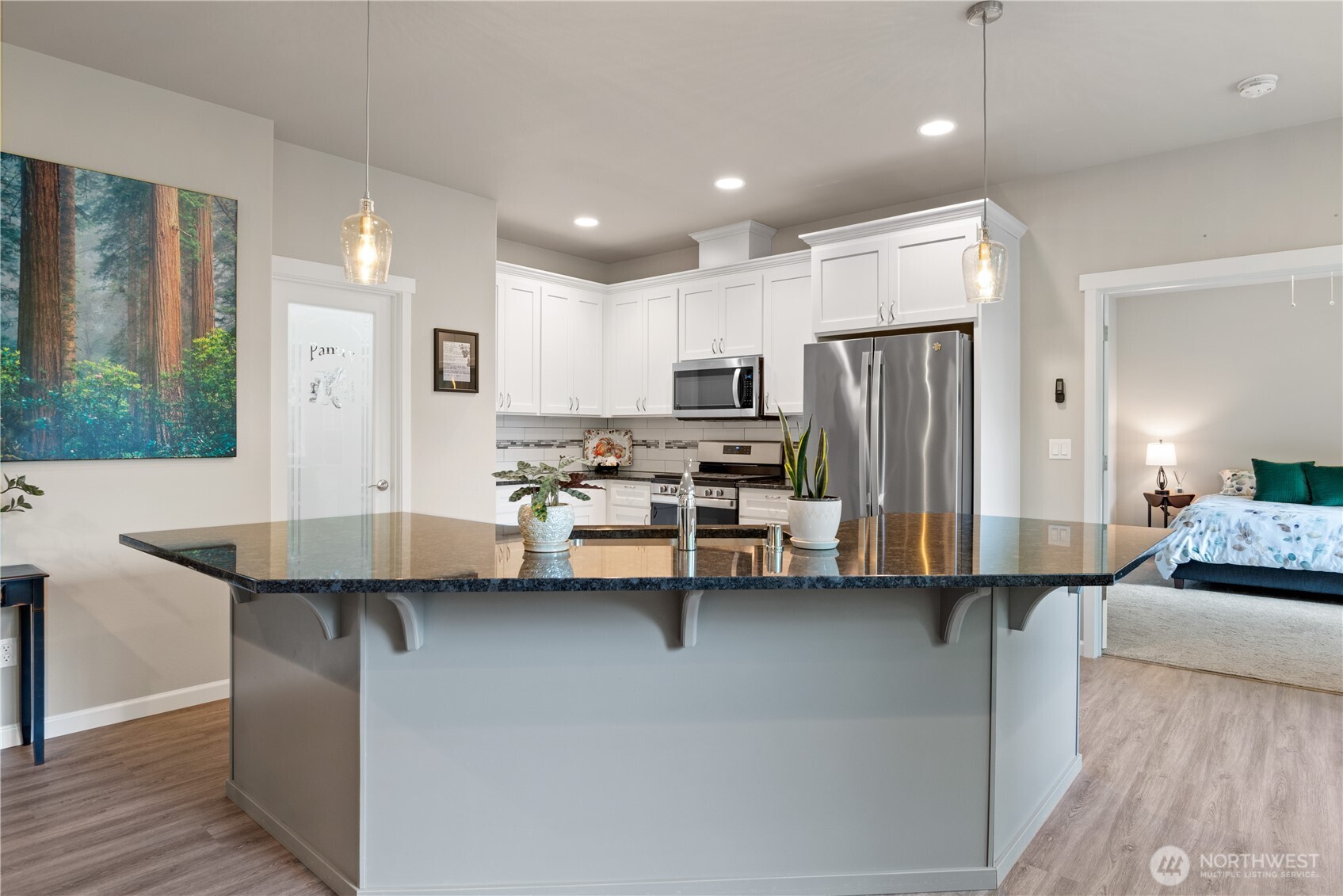 175 Shoreview Drive Kelso, WA 98626 - Photo 12 of 35 a kitchen with stainless steel appliances kitchen island granite countertop a sink refrigerator and cabinets