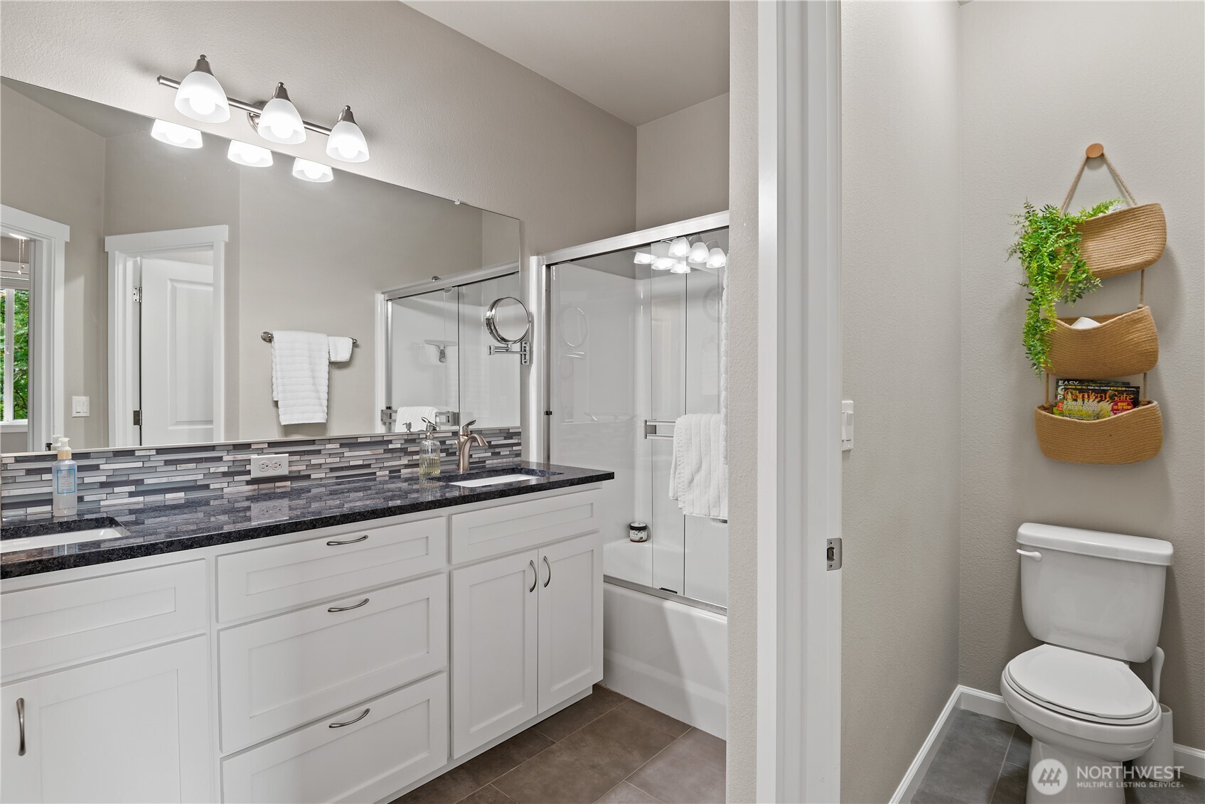 175 Shoreview Drive Kelso, WA 98626 - Photo 17 of 35 a bathroom with a granite countertop sink a toilet and a mirror