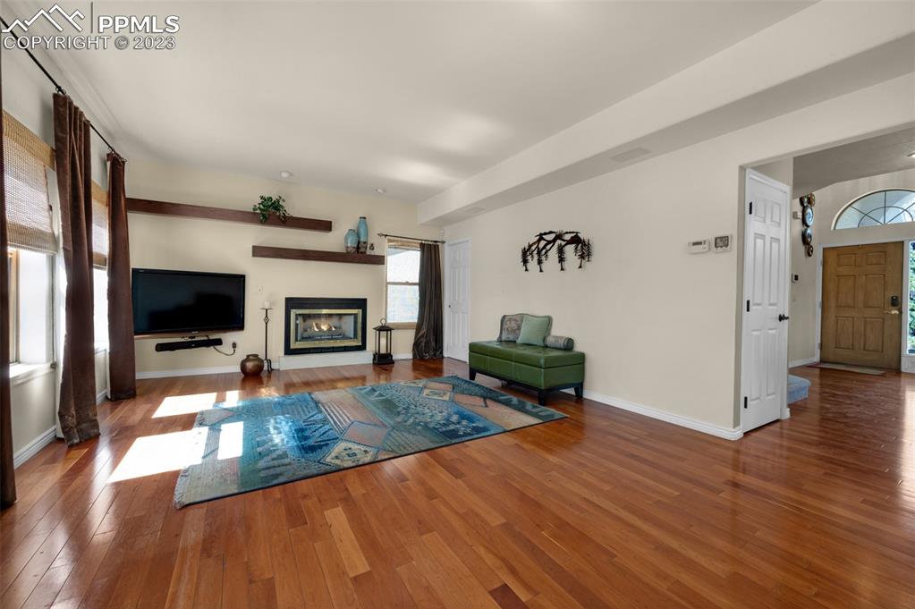 7425 Tobin Road Colorado Springs, CO 80908 - Photo 13 of 49 a living room with furniture flat screen tv and a fireplace