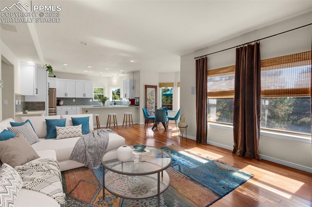 7425 Tobin Road Colorado Springs, CO 80908 - Photo 16 of 49 a living room with furniture and a large window