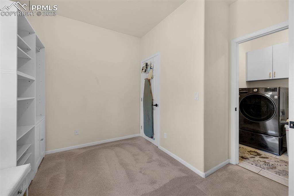 7425 Tobin Road Colorado Springs, CO 80908 - Photo 24 of 49 a view of a storage & utility room with washer and dryer