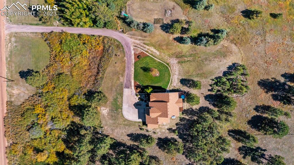7425 Tobin Road Colorado Springs, CO 80908 - Photo 3 of 49 an aerial view of a house with a yard
