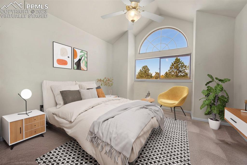 7425 Tobin Road Colorado Springs, CO 80908 - Photo 33 of 49 a bedroom with bed and a table