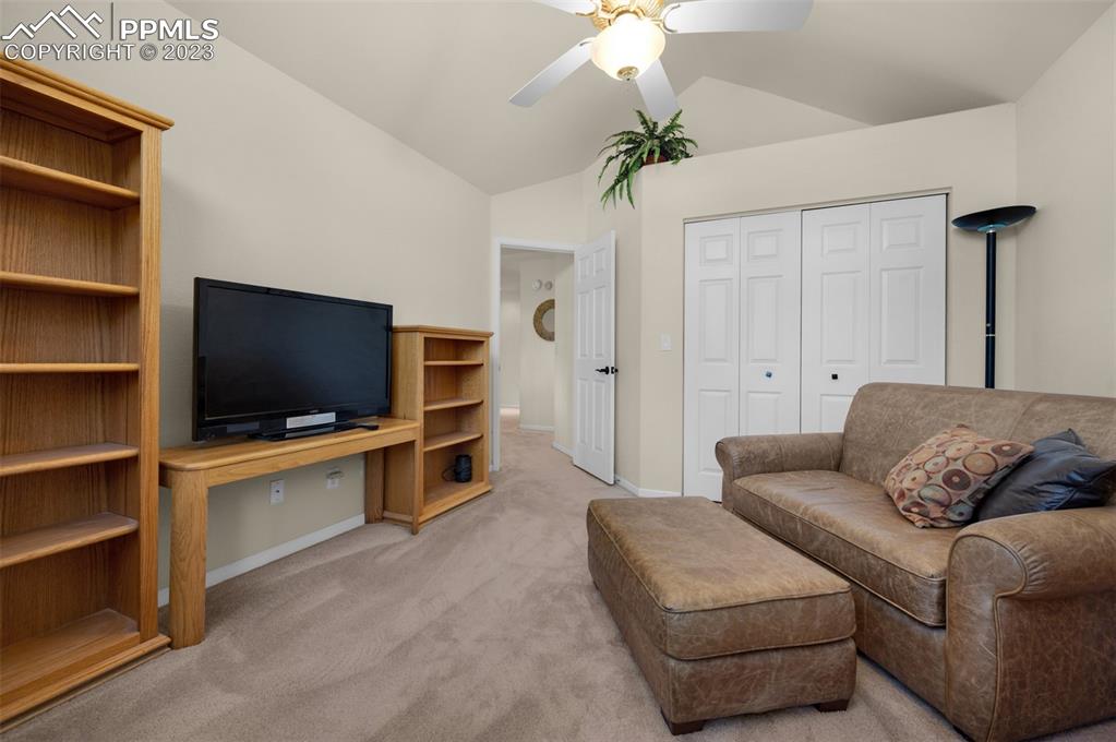 7425 Tobin Road Colorado Springs, CO 80908 - Photo 35 of 49 a living room with furniture and a flat screen tv