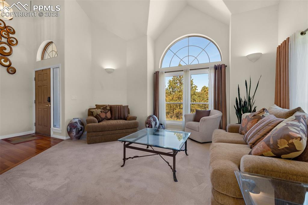 7425 Tobin Road Colorado Springs, CO 80908 - Photo 5 of 49 a living room with furniture and a large window