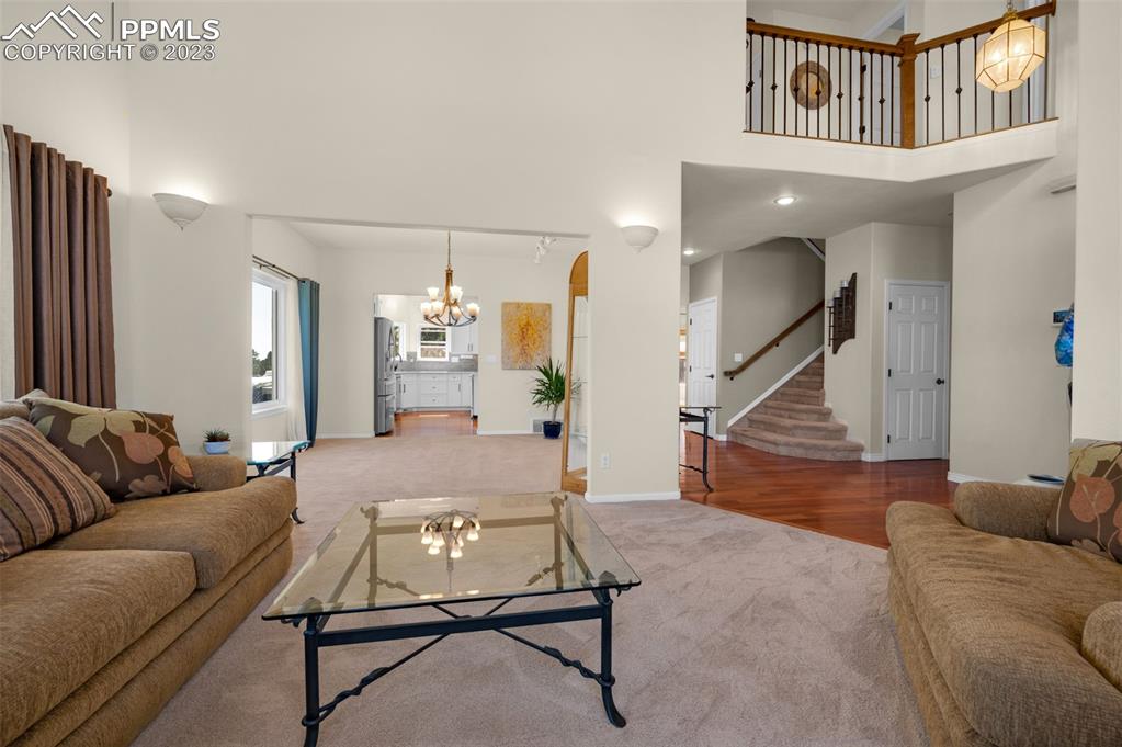 7425 Tobin Road Colorado Springs, CO 80908 - Photo 7 of 49 a living room with furniture and wooden floor