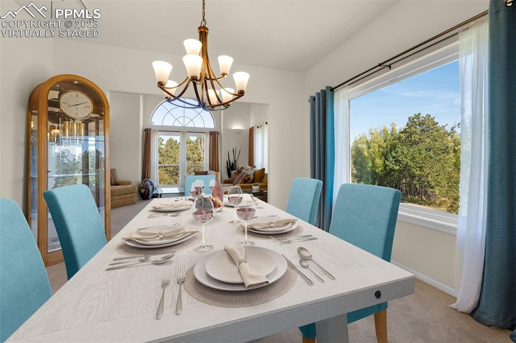 7425 Tobin Road Colorado Springs, CO 80908 - Photo 8 of 49 a view of a dining room with furniture window and wooden floor