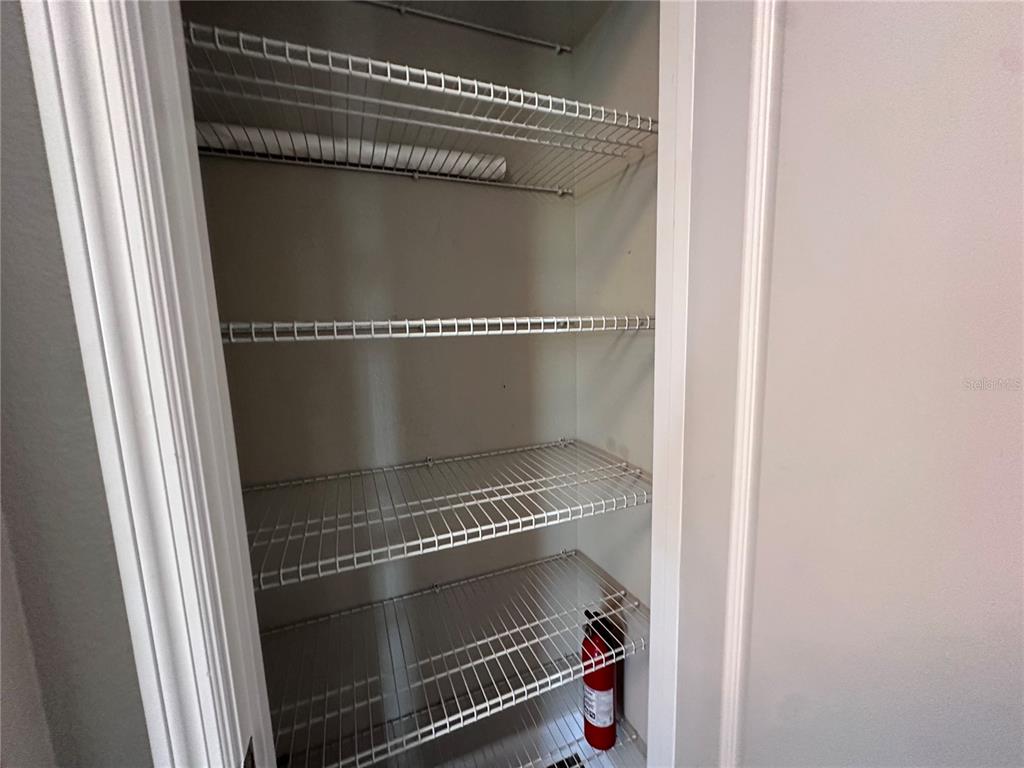 9319 Richet Place Orlando, FL 32827 - Photo 19 of 50 a refrigerator in a kitchen