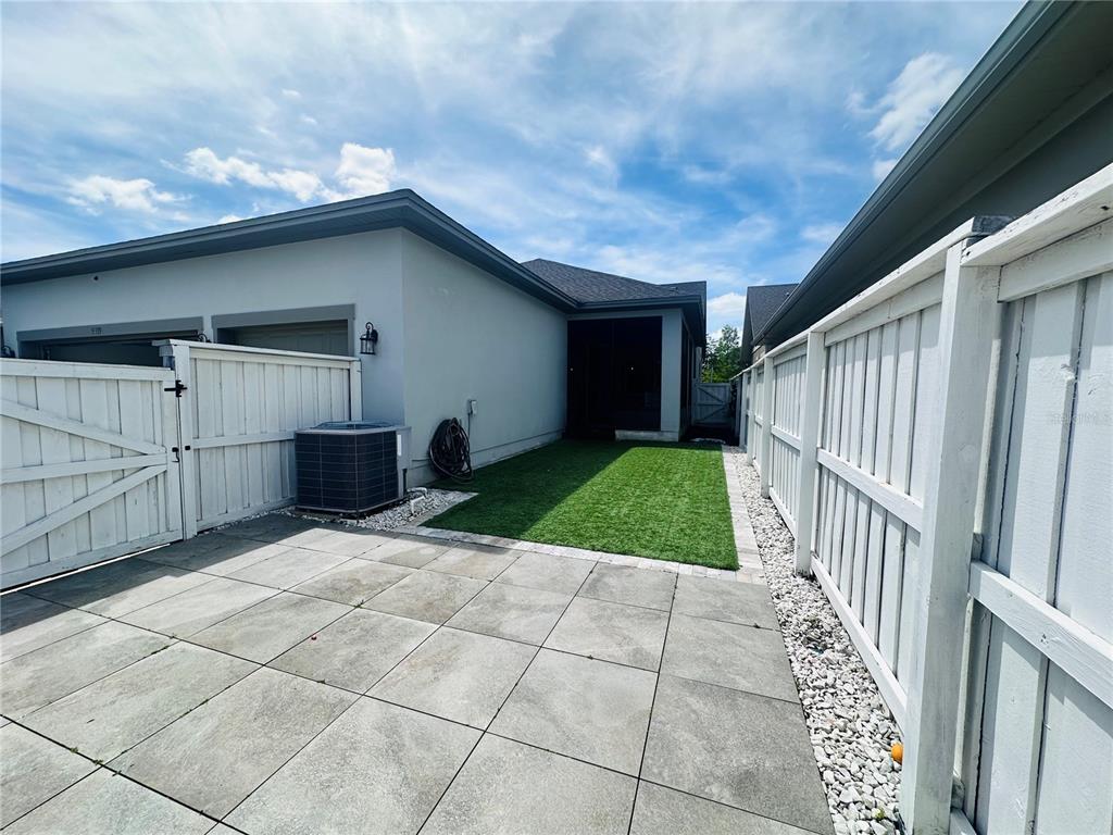 9319 Richet Place Orlando, FL 32827 - Photo 29 of 50 a view of backyard with entertaining space