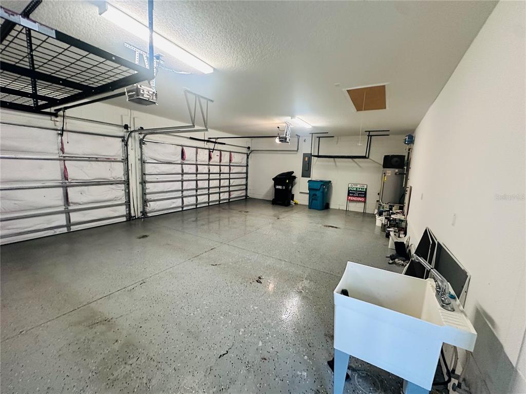 9319 Richet Place Orlando, FL 32827 - Photo 31 of 50 a view of a room with gym equipment