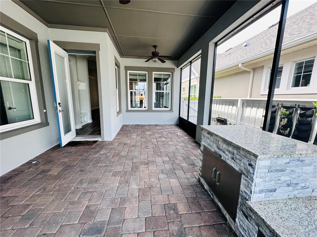 9319 Richet Place Orlando, FL 32827 - Photo 34 of 50 a view of entryway with a brick wall