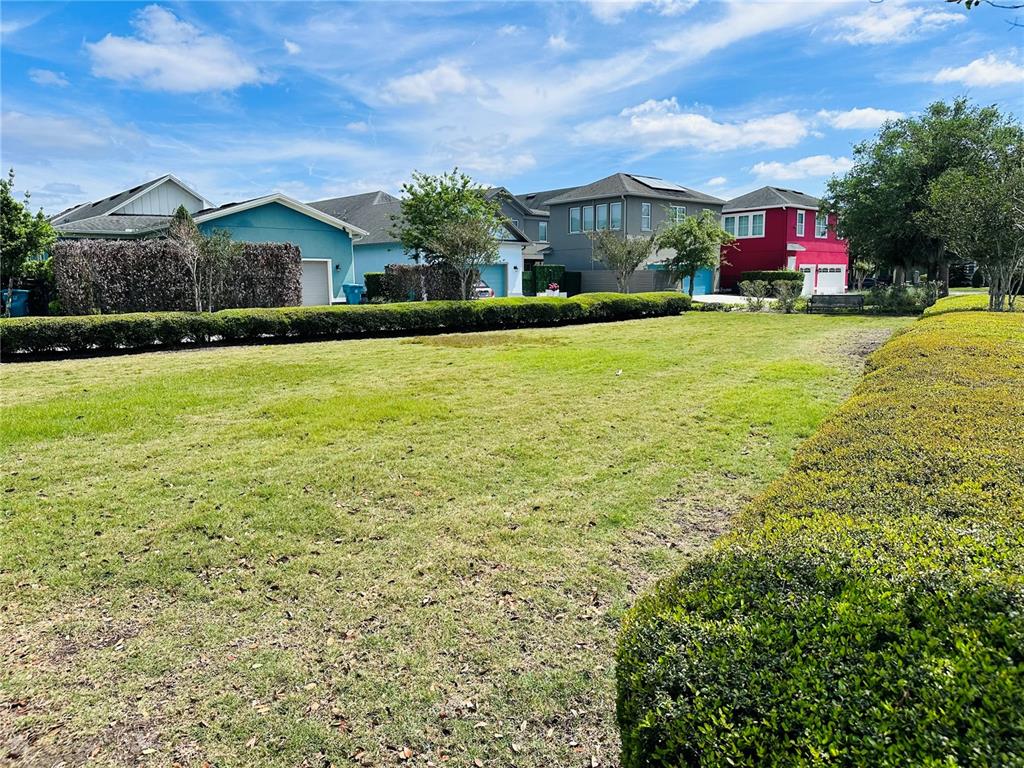 9319 Richet Place Orlando, FL 32827 - Photo 46 of 50 a view of a house with a yard