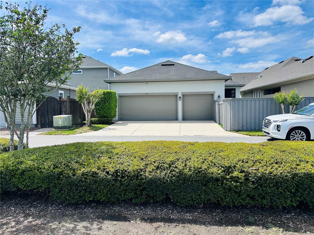 9319 Richet Place Orlando, FL 32827 - Photo 47 of 50 a house view with a garden space