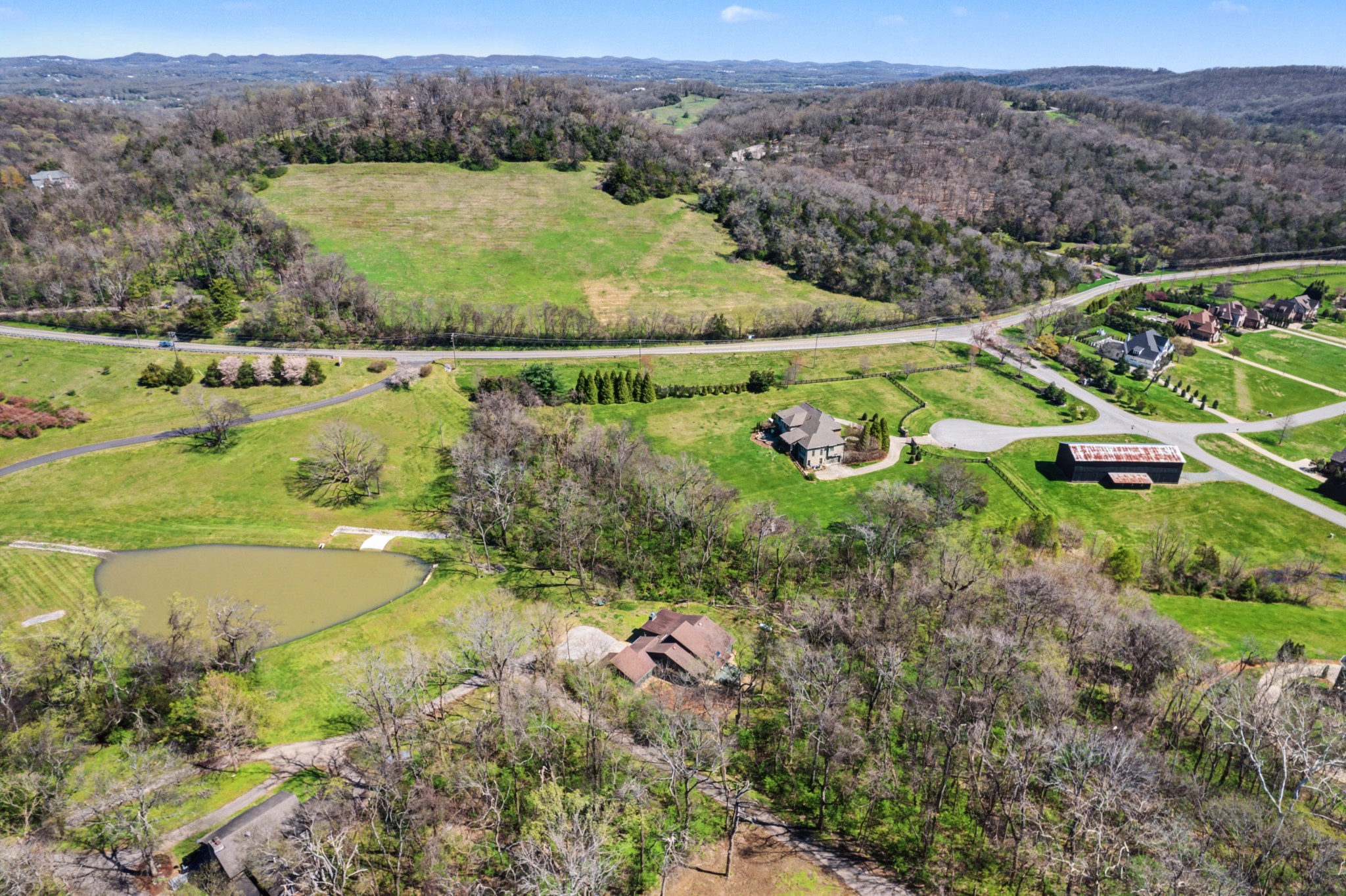 4677 Celeste Lane Franklin, TN 37064 - Photo 55 of 56 an aerial view of green landscape with trees houses and mountain view