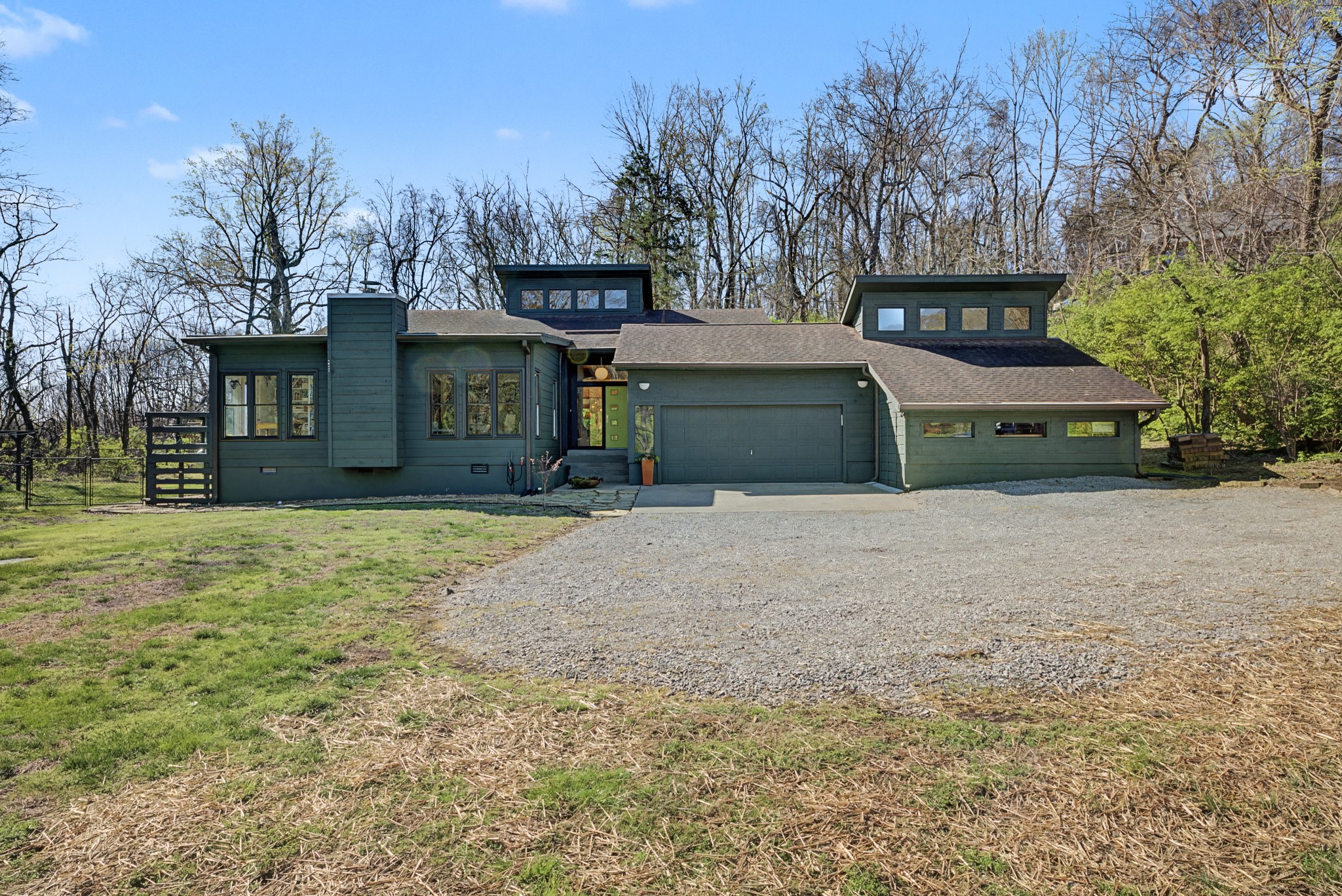 4677 Celeste Lane Franklin, TN 37064 - Photo 7 of 56 a front view of a house with a yard and garage