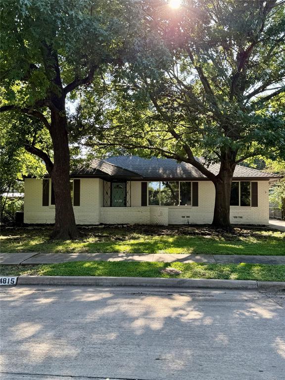 4815 Kelman Street Dallas, TX 75214 - Photo 1 of 16 Single story home with brick siding and roof with shingles
