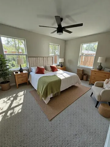 a bedroom with a bed couch and window