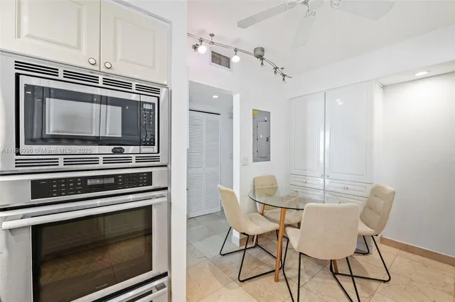 a kitchen with a stove and a microwave
