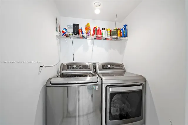 a utility room with dryer and washer