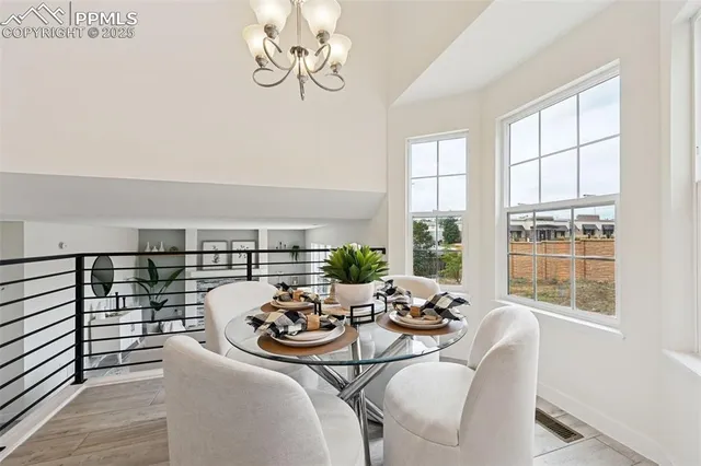 a view of a dining room with furniture window and outside view