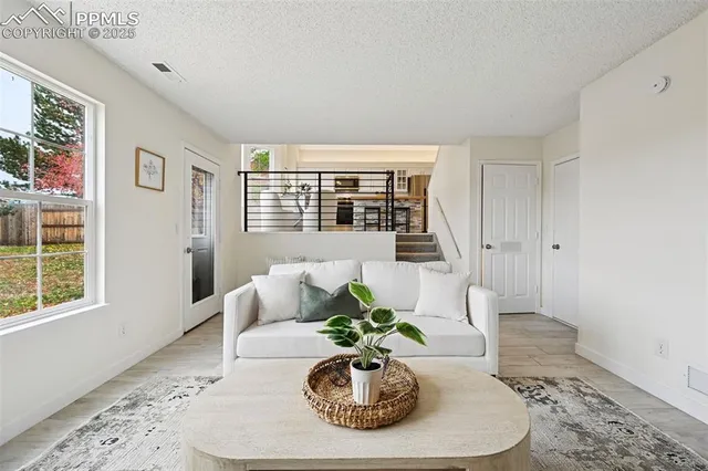 a vase of flowers sitting on a dining table