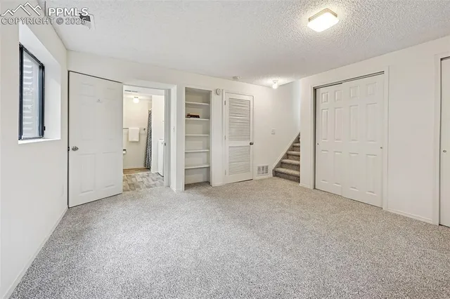 an empty room with walk in closet and closet