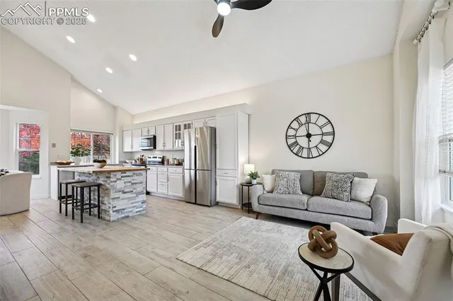 a living room with furniture and a table