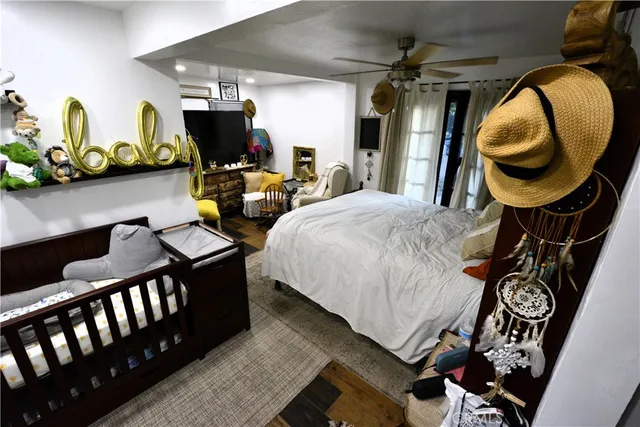 a view of a livingroom with furniture and a flat screen tv
