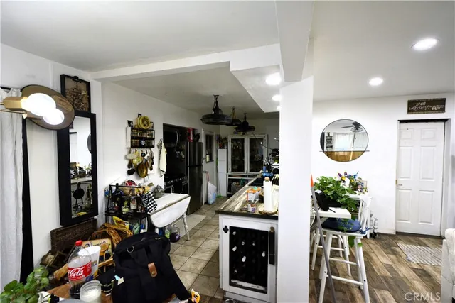 a living room with furniture a table and chairs
