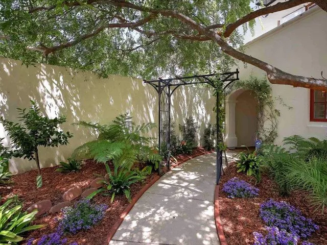 a backyard of a house with outdoor seating and green space