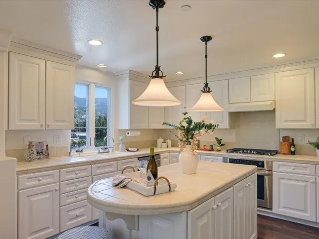 a kitchen with a sink and cabinets