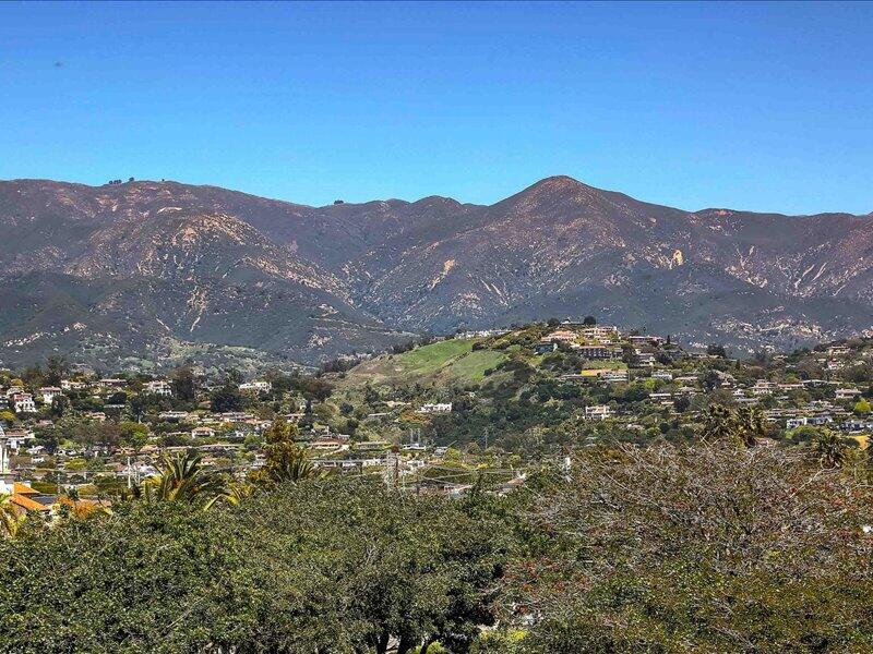 220 Santa Barbara Street, Unit B Santa Barbara, CA 93101 - Photo 2 of 25 a view of a mountain range in a cloudy sky