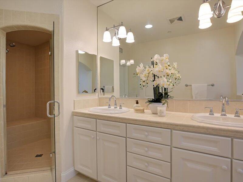 220 Santa Barbara Street, Unit B Santa Barbara, CA 93101 - Photo 21 of 25 a bathroom with a sink mirror and a shower