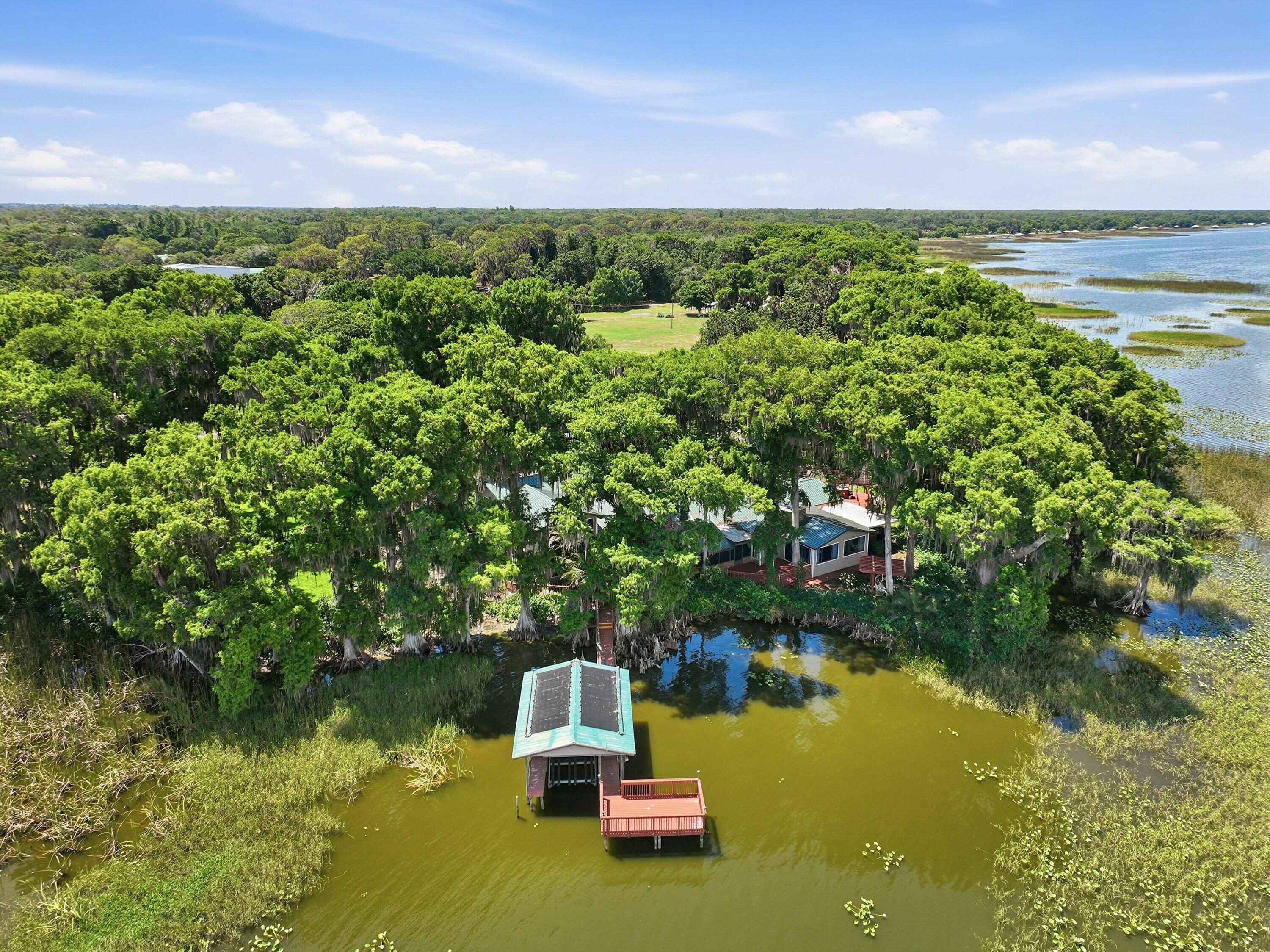 200 Windy Point Road Lake Placid, FL 33852 - Photo 66 of 74 a view of a lake with houses