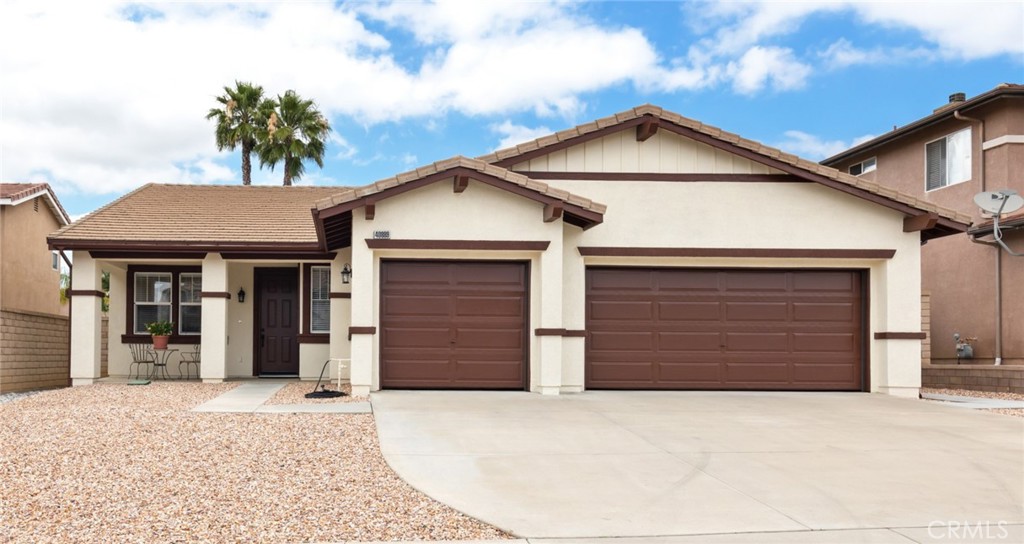 40889 Robards Way Murrieta, CA 92562 - Photo 1 of 36 a front view of a house with a yard and garage