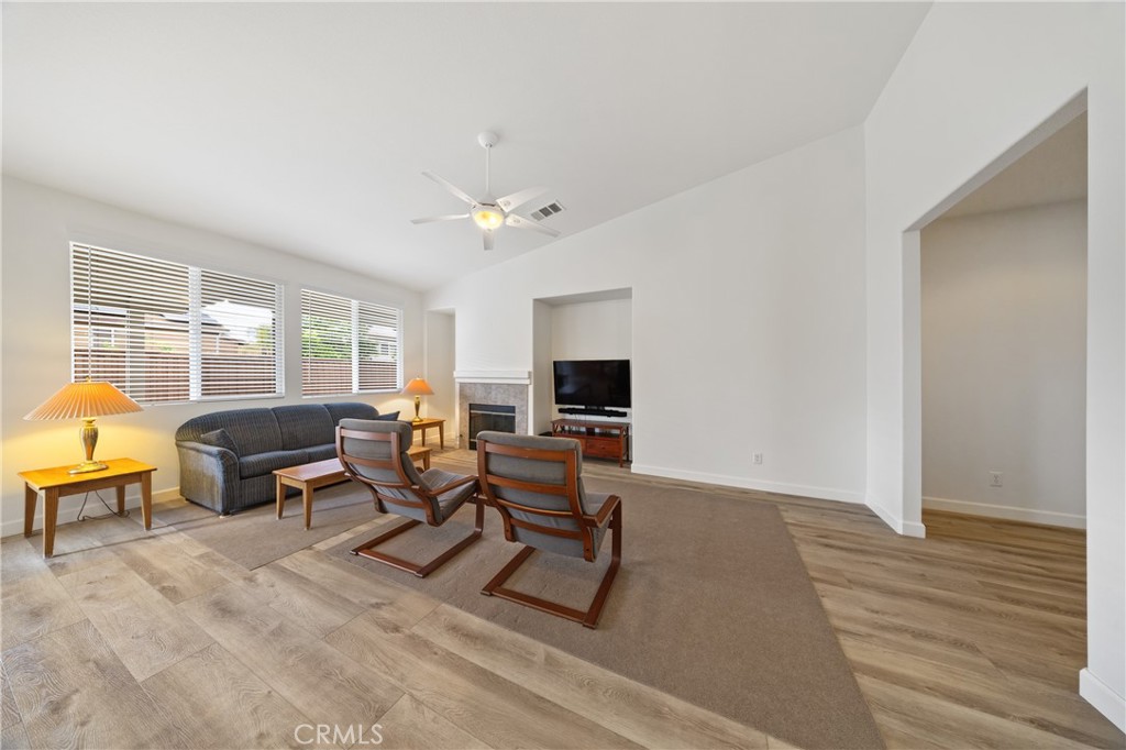 40889 Robards Way Murrieta, CA 92562 - Photo 13 of 36 a living room with furniture and a flat screen tv