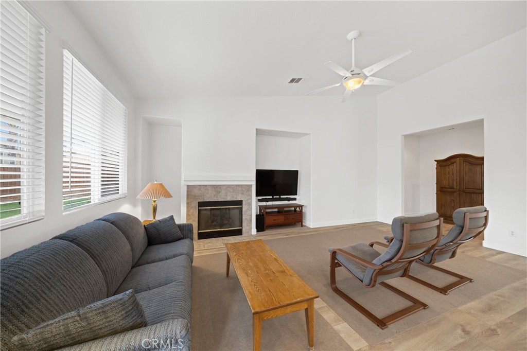 40889 Robards Way Murrieta, CA 92562 - Photo 14 of 36 a living room with furniture and a flat screen tv