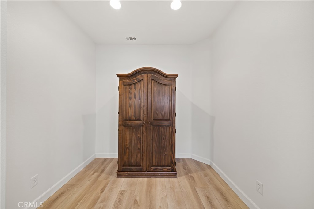40889 Robards Way Murrieta, CA 92562 - Photo 15 of 36 a view of a room with wooden floor