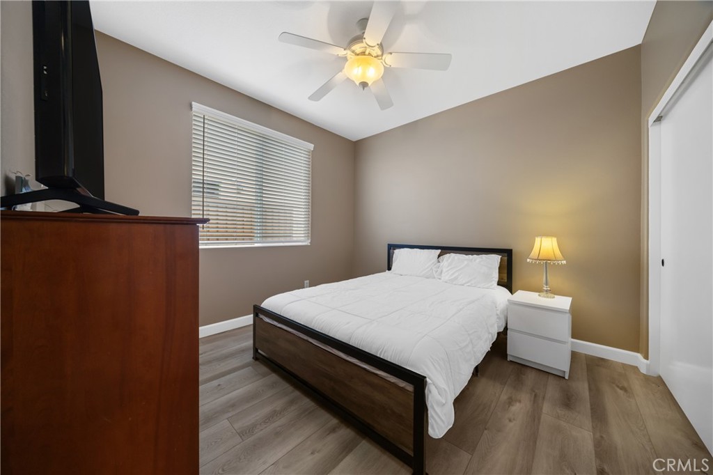 40889 Robards Way Murrieta, CA 92562 - Photo 22 of 36 a bedroom with a bed and a chandelier