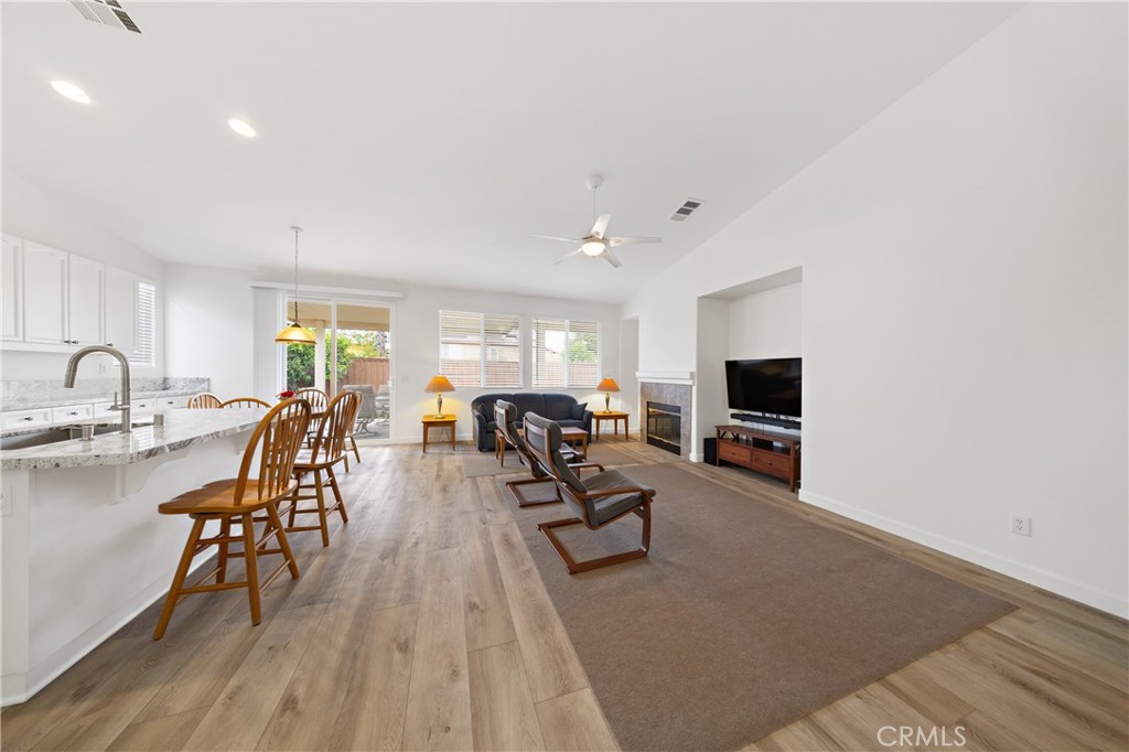 40889 Robards Way Murrieta, CA 92562 - Photo 36 of 36 a living room with furniture a flat screen tv and a large window