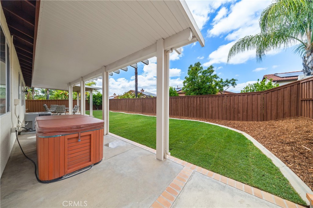 40889 Robards Way Murrieta, CA 92562 - Photo 5 of 36 a view of a backyard with a garden and deck