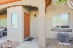 7701 West Robindale Road, Unit 277 Las Vegas, NV 89113 - Photo 3 of 33 A welcoming front entrance with warm-toned stucco and a natural wood door awaits.