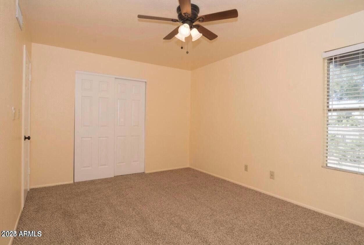 16225 North 30th Street, Unit 9 Phoenix, AZ 85032 - Photo 11 of 19 a view of a window in an empty room