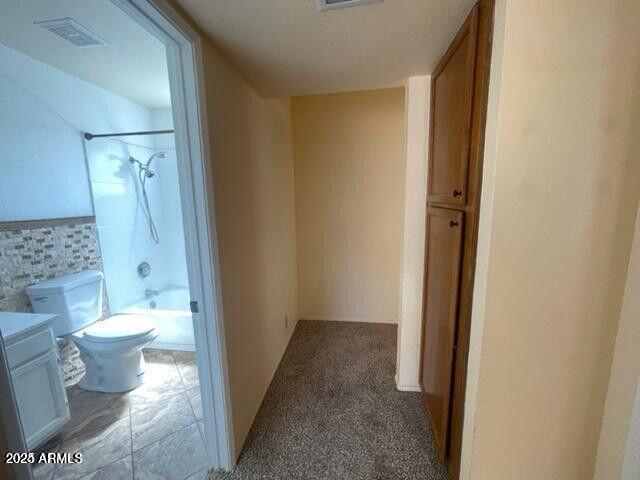 16225 North 30th Street, Unit 9 Phoenix, AZ 85032 - Photo 12 of 19 a bathroom with a toilet and a shower
