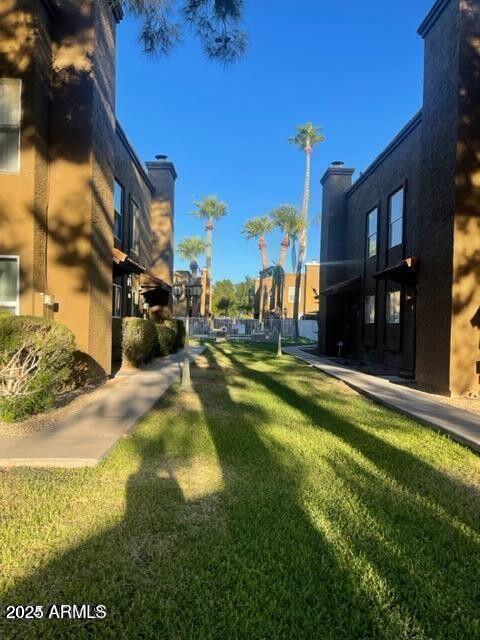 16225 North 30th Street, Unit 9 Phoenix, AZ 85032 - Photo 17 of 19 a view of a house with swimming pool