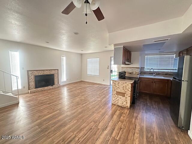16225 North 30th Street, Unit 9 Phoenix, AZ 85032 - Photo 2 of 19 a kitchen with a refrigerator and a stove top oven