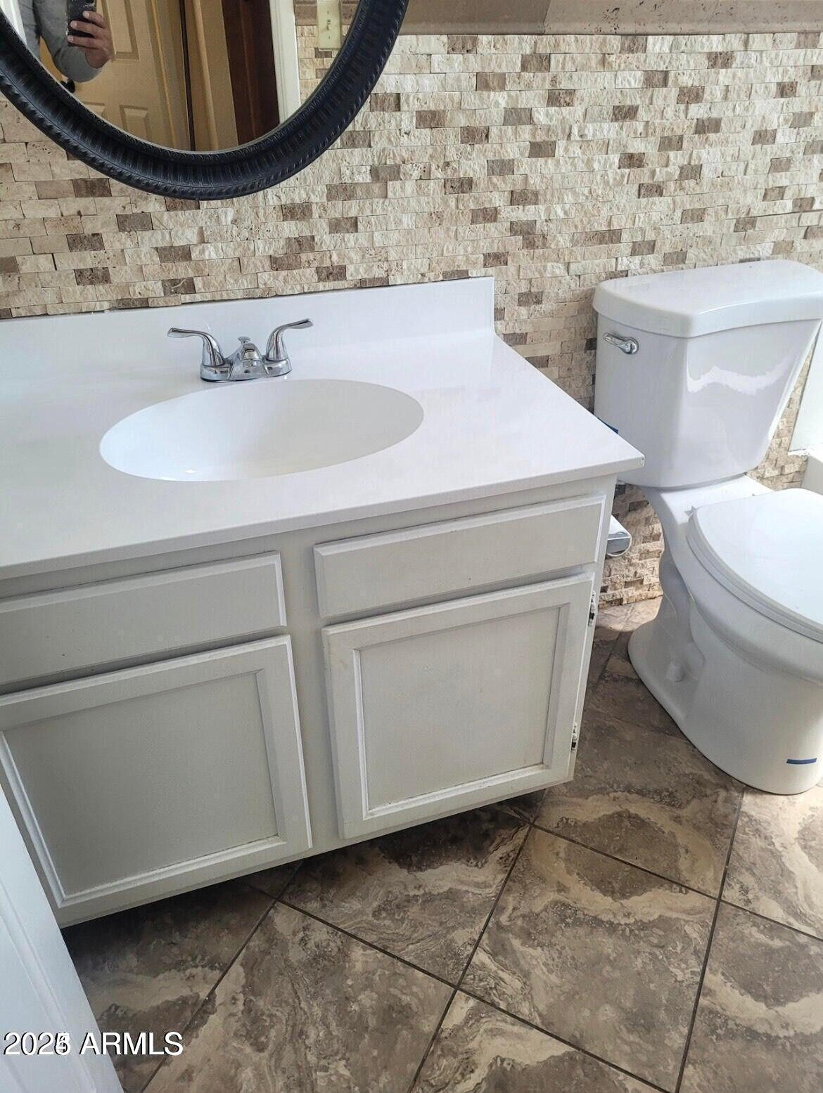 16225 North 30th Street, Unit 9 Phoenix, AZ 85032 - Photo 5 of 19 a bathroom with a sink and a mirror